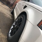 Black rims on a white Range Rover