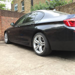 black BMW with white rims