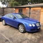 Blue Bentley with silver alloys